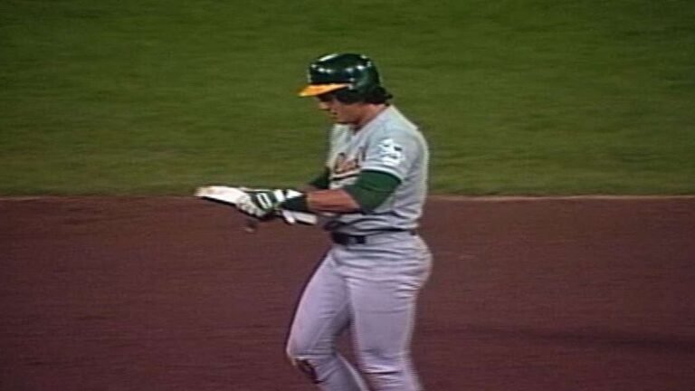 Jose Canseco holds up second base after stealing his 40th of the season to complete the 40-40 club, September 23 1988