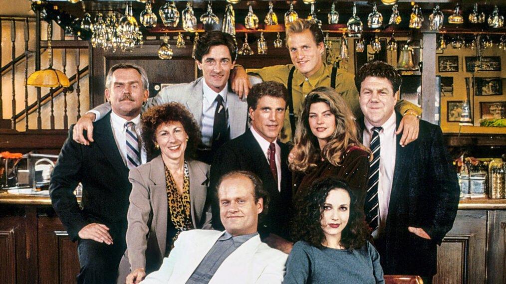 Cheers cast in later seasons including Woody Harrelson as Woody Boyd and Kirstie Alley as Rebecca Howe