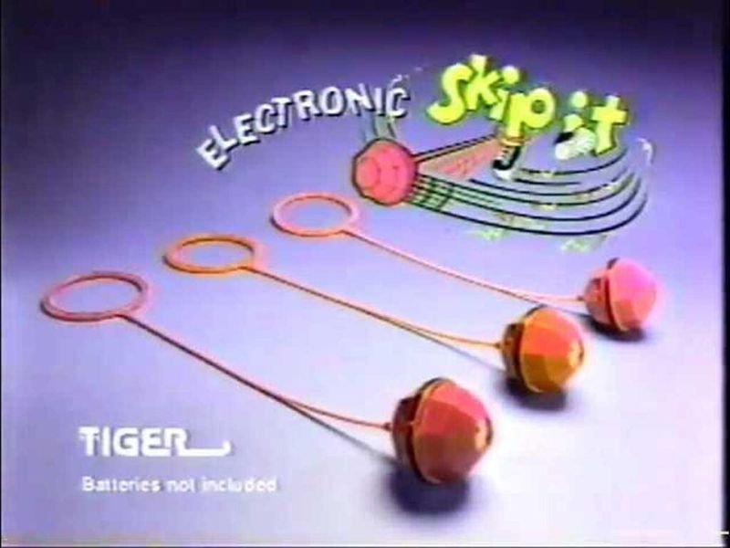 Three Electronic Skip-It toys from a 1990s Tiger Toys commercial