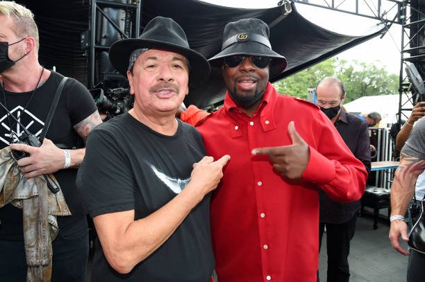 Carlos Santana and Wyclef Jean pose backstage during We Love NYC: The Homecoming Concert Produced by NYC, Clive Davis, and Li