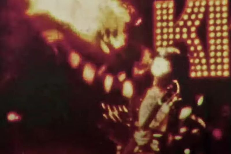 Gene Simmons breathing fire on stage during a KISS concert