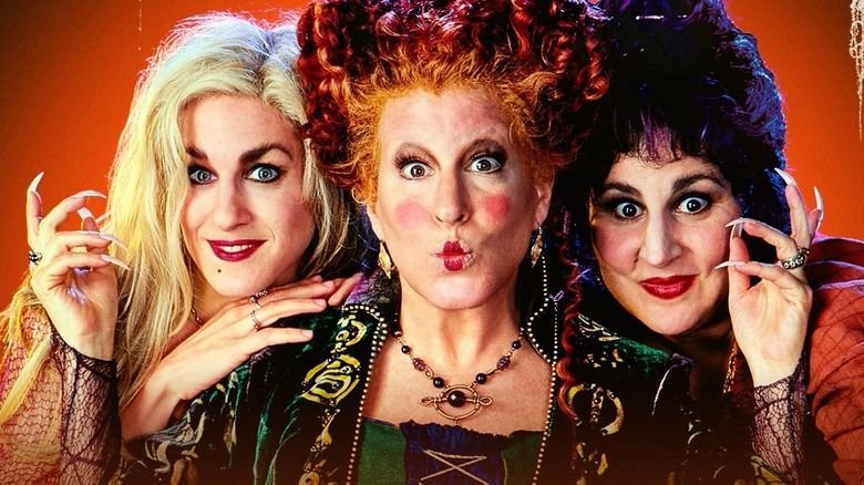 The Sanderson sisters reading from the spell book in Hocus Pocus 1993