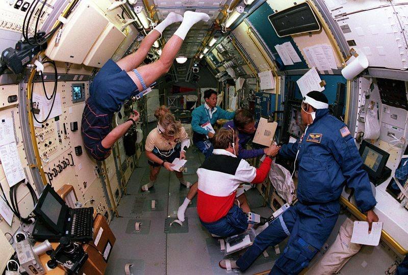 STS-47 crew members in the Spacelab-J module aboard Space Shuttle Endeavour 1992