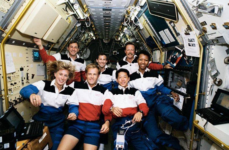 STS-47 seven-member crew in-flight portrait aboard Space Shuttle Endeavour 1992