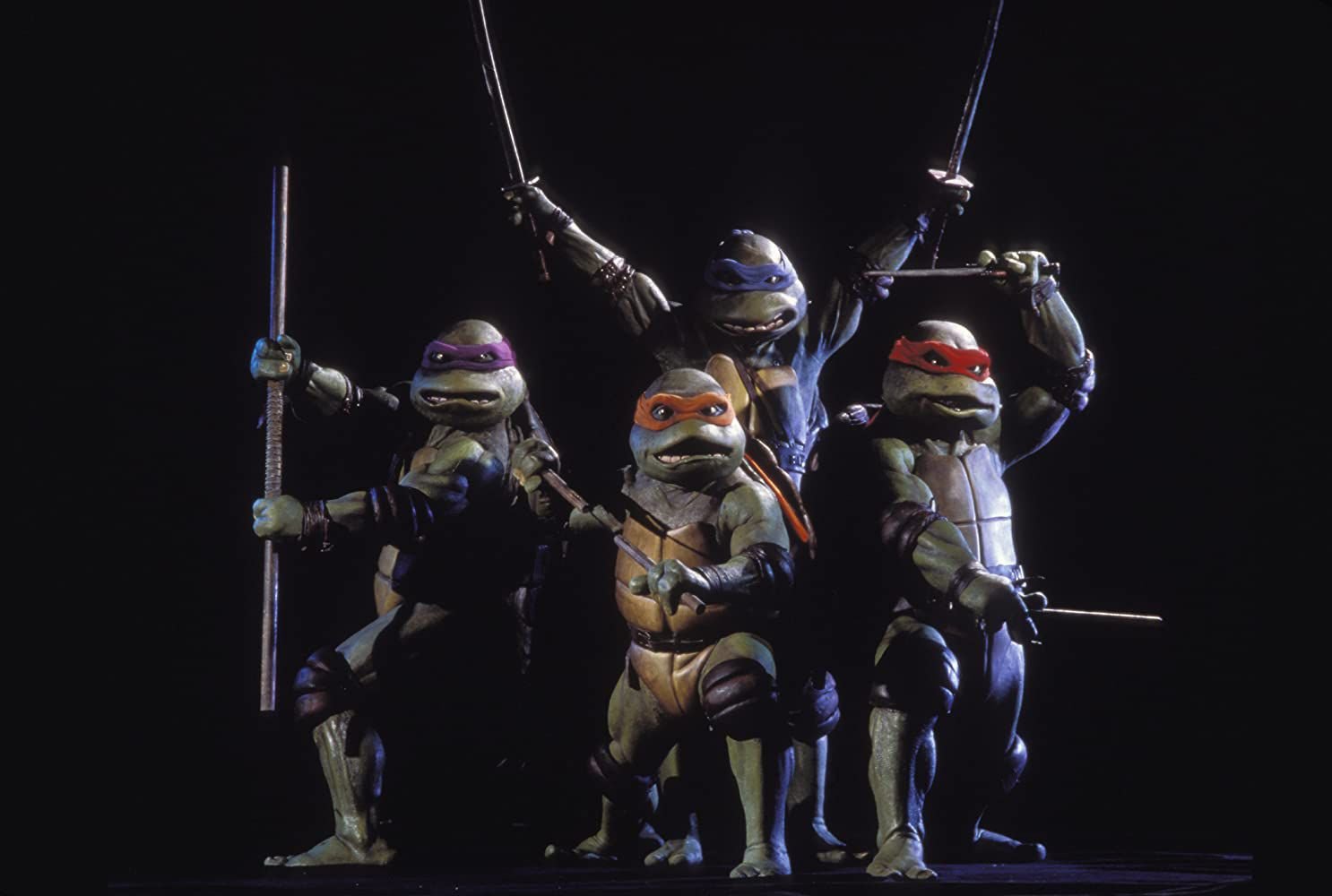 The four Teenage Mutant Ninja Turtles in their 1990 movie suits built by Jim Henson's Creature Shop