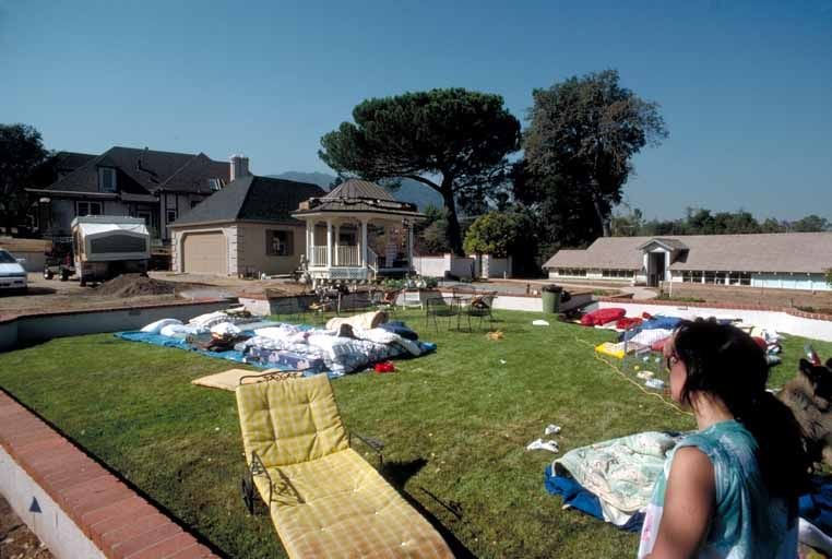 A Bay Area family camps in their backyard after the 1989 Loma Prieta earthquake made their home unsafe