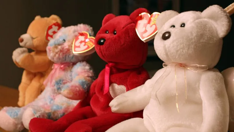 Four Beanie Babies bears lined up showing their red heart-shaped Ty tags