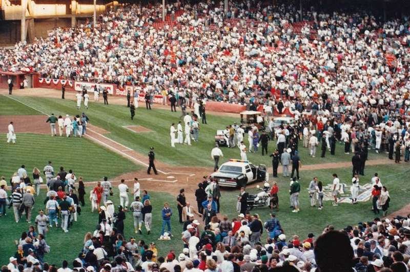 Players, police, and fans gather on the Candlestick Park field minutes after the 1989 World Series earthquake