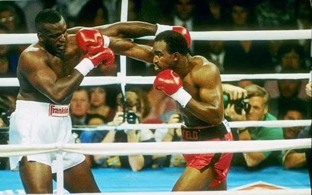 Evander Holyfield lands the right hand that drops Buster Douglas in their October 25 1990 heavyweight title fight