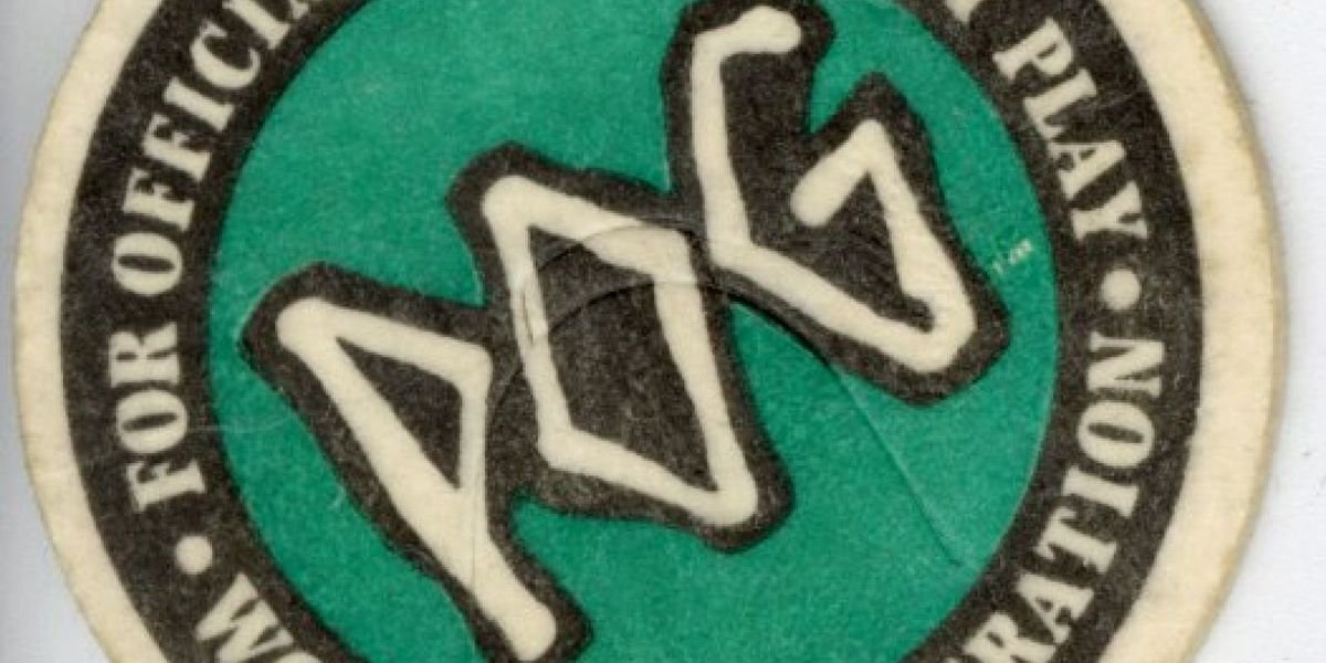 Close-up of an original 1990s POG milk cap bearing the official brand logo