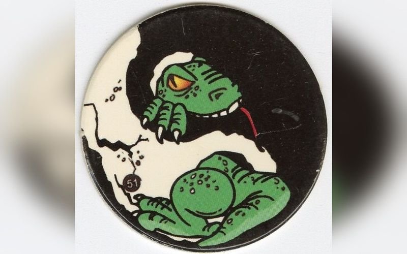 Vintage cartoon dinosaur pogs milk cap from the 1990s