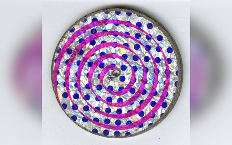 Metal slammer used to flip pogs caps during 1990s playground games