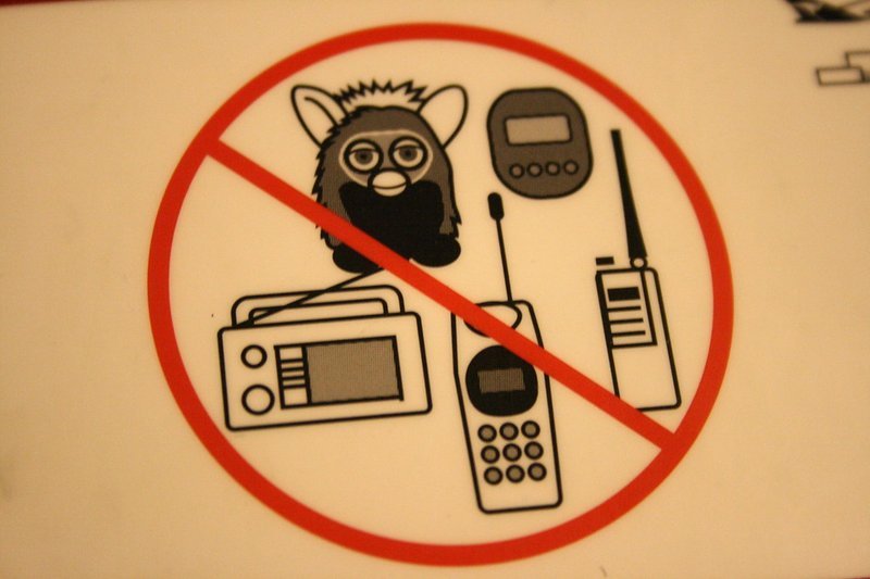 A hand-lettered no Furbies warning sign, echoing the 1999 NSA ban on the talking toy