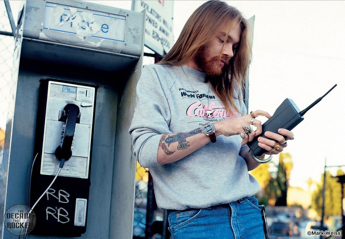 Axl Rose using a portable phone at a payphone in Los Angeles, 1988