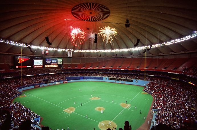 Interior of the Kingdome during a Mariners night game with fireworks over the field