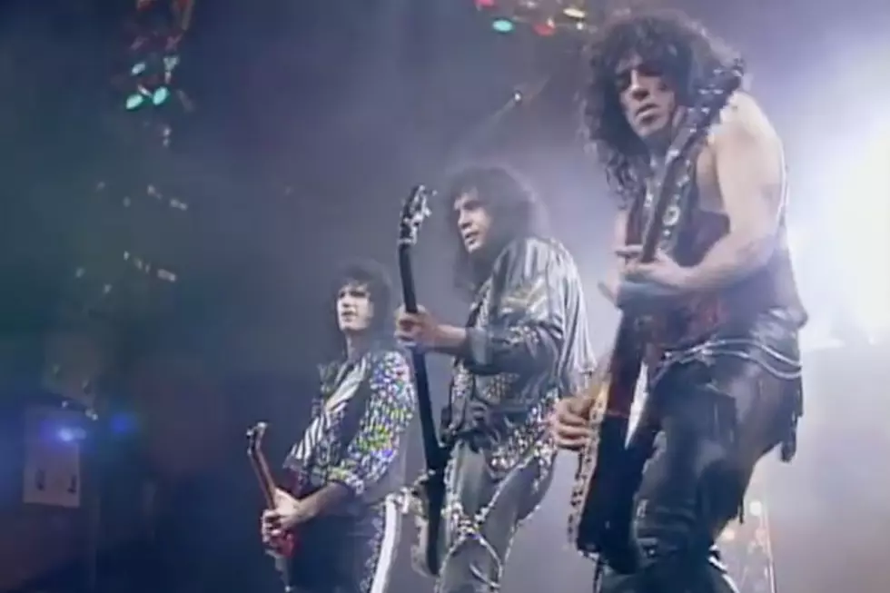 KISS performing live onstage during the Hot in the Shade tour era