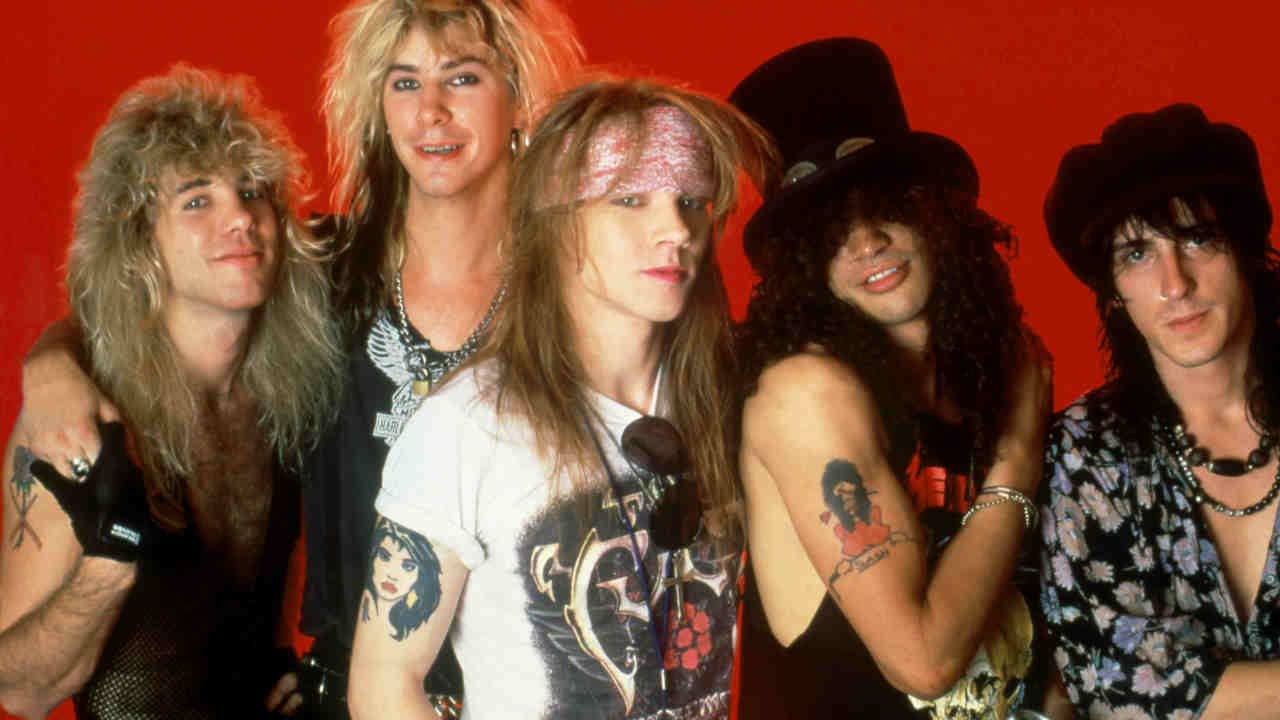 Guns N' Roses — Steven Adler, Duff McKagan, Axl Rose, Slash, and Izzy Stradlin — posed band photo