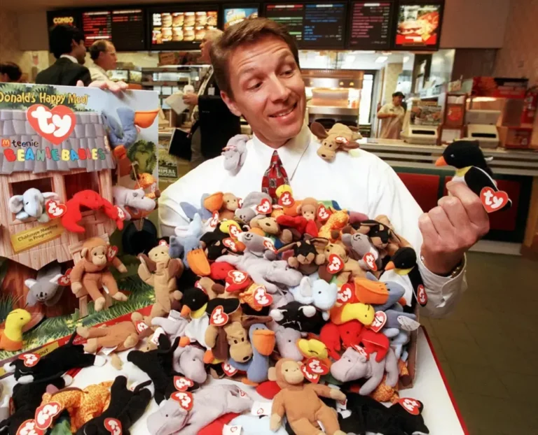 McDonald's executive holding a pile of Teenie Beanie Babies during the 1997 Happy Meal promotion
