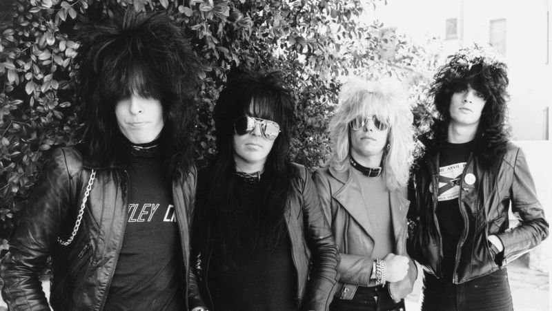 Mötley Crüe — Mick Mars, Nikki Sixx, Vince Neil, and Tommy Lee — in an early 1980s band portrait on the Sunset Strip