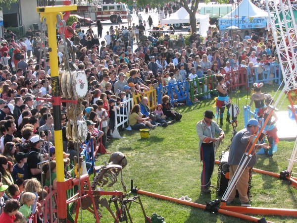 Large crowd watching the Life Size Mousetrap machine in action at Maker Faire