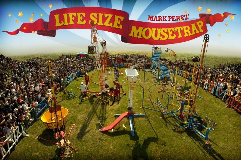 Mark Perez's Life Size Mousetrap installation with a crowd watching the full-scale Rube Goldberg machine