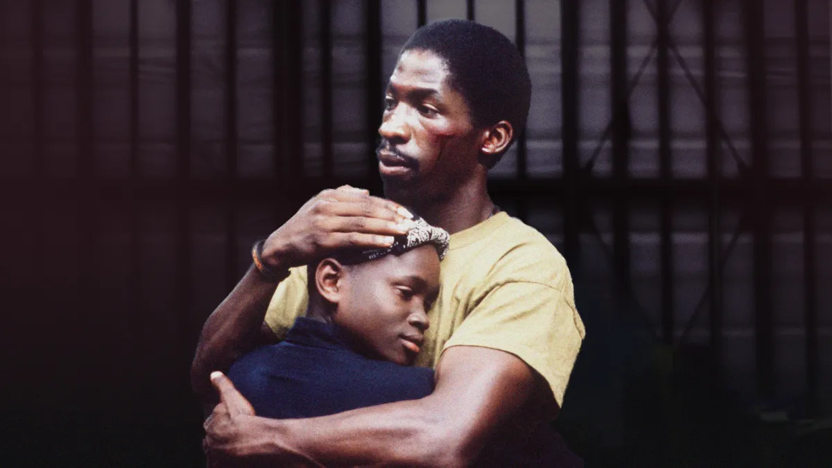South Central 1992 movie Bobby Johnson embraces his son Jimmie