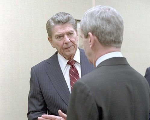 President Reagan talking with National Security Advisor Robert McFarlane about the Achille Lauro hijacking in 1985