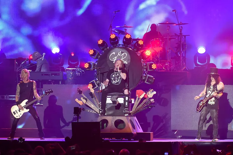 Axl Rose, Duff McKagan, and Slash performing together during the Not in This Lifetime reunion tour, 2016