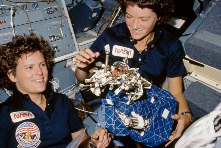 Sally Ride and Kathryn Sullivan on Challenger's flight deck during the STS-41G mission, October 1984