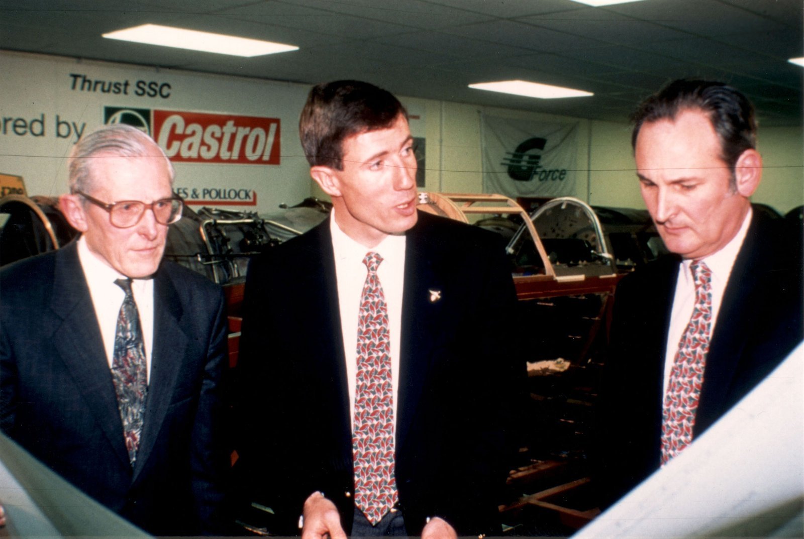 Richard Noble, Ron Ayers and Andy Green studying ThrustSSC construction plans