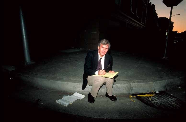 Tom Brokaw of NBC News prepares his script for a live broadcast from the Marina District after the 1989 earthquake
