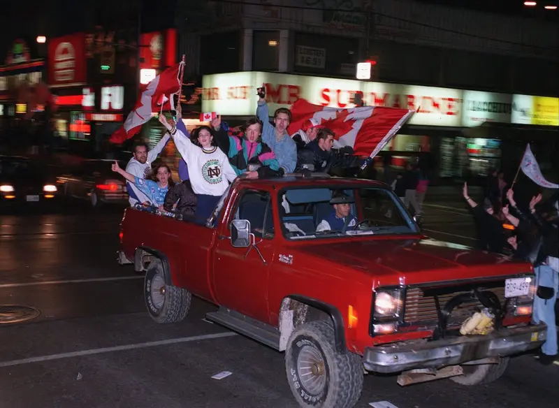 Toronto Blue Jays fans celebrate in the streets of downtown Toronto after the 1992 World Series win