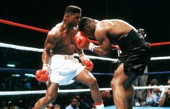 Tyrell Biggs connects with a punch on Mike Tyson during the early rounds of their 1987 heavyweight title fight