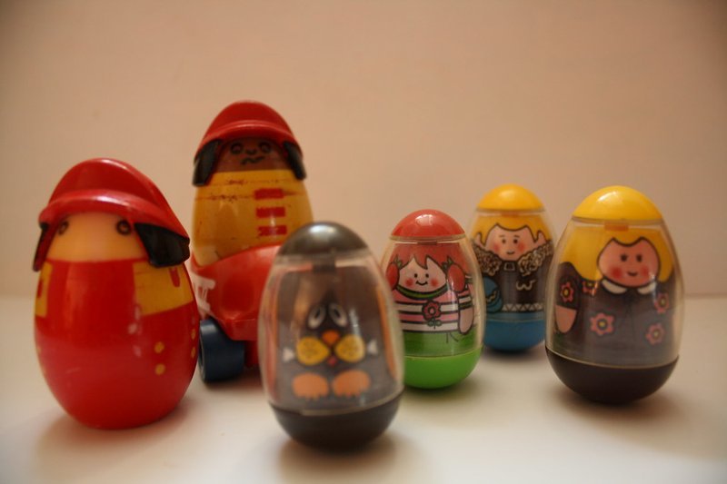 group of classic 1970s Weebles egg-shaped toy figures with painted characters