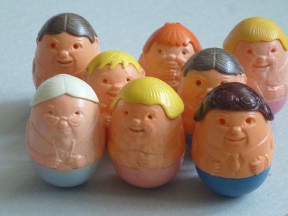 collection of classic Weebles egg-shaped toy figures with painted faces